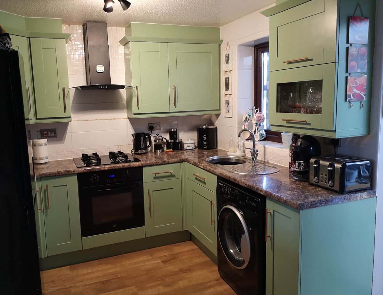 Wood kitchen resprayed in green
