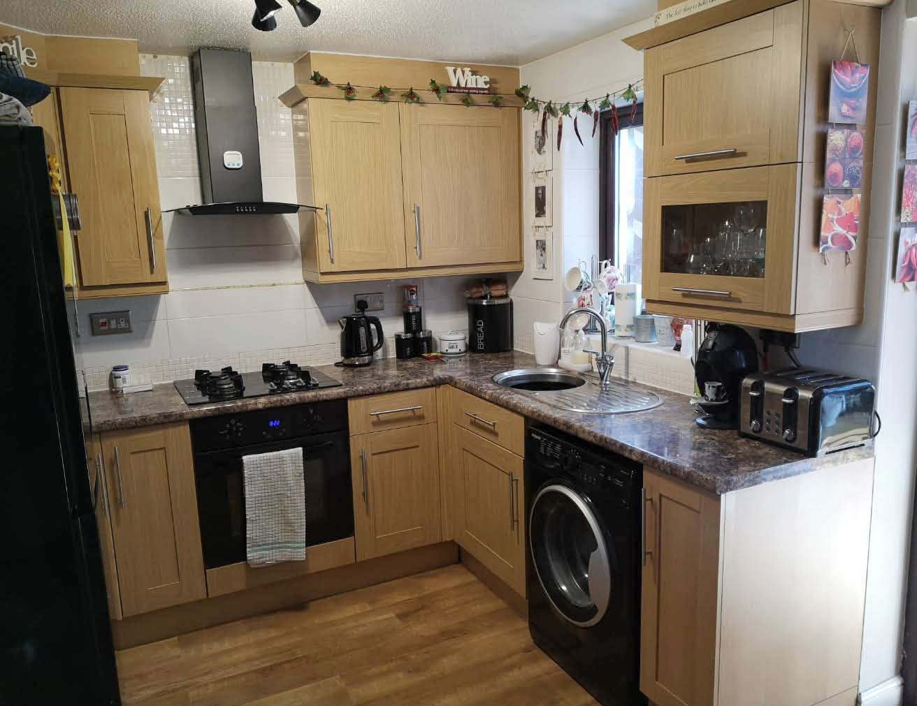 Old style wooden effect kitchen before spray